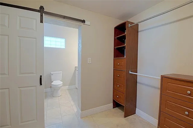 a bathroom with a toilet sink and vanity