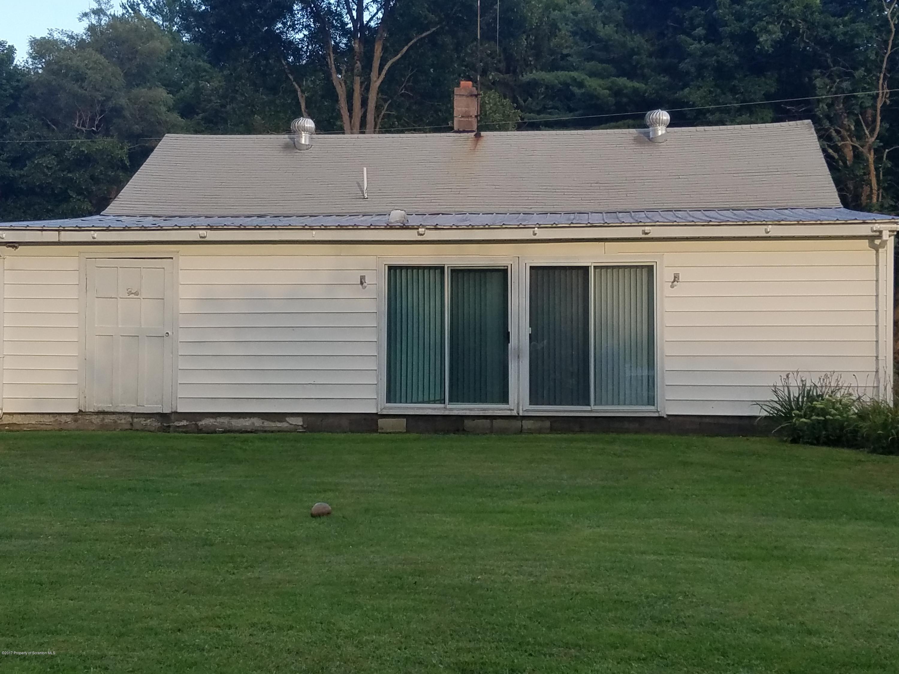 477 Randolph Road Great Bend, PA 18821 - Photo 3 of 23 a front view of a house with a yard and garage