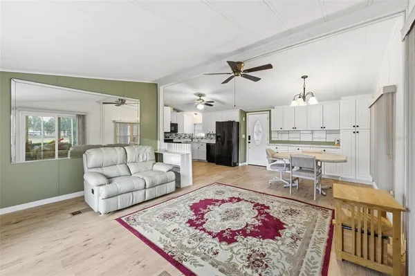 a living room with furniture and a rug