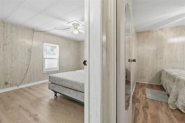 a spacious bedroom with a bed and a table
