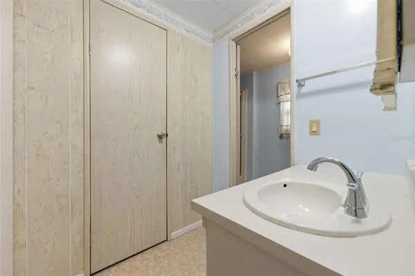 a bathroom with a sink and vanity