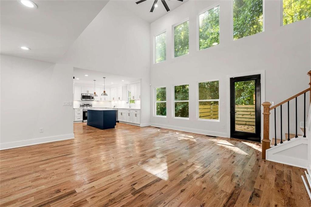 1606 Blvd Lorraine Southwest Atlanta, GA 30311 - Photo 11 of 24 a view of an empty room with a window and wooden floor