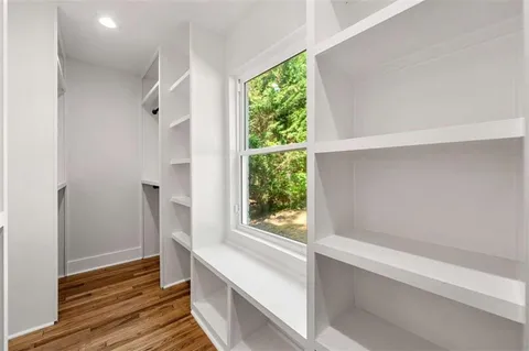 a bathroom with a bathtub and a window