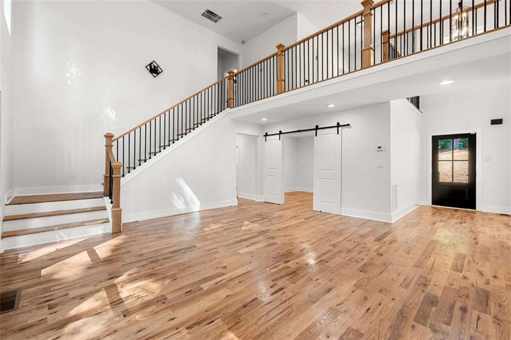 1606 Blvd Lorraine Southwest Atlanta, GA 30311 - Photo 9 of 24 a view of empty room with wooden floor