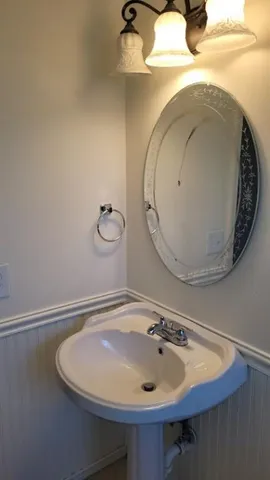 a bathroom with a sink and mirror