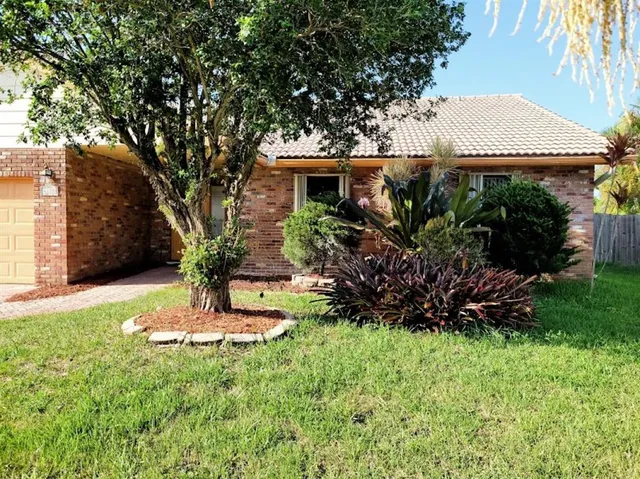 a view of a house with a garden