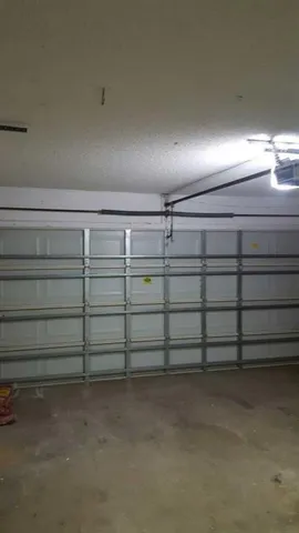 a dining room with furniture and a potted plant