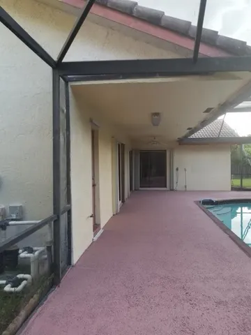 a view of a room that has a large window