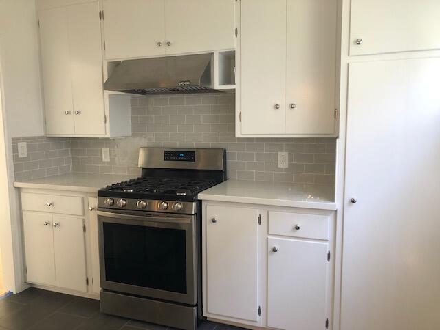 2030 State Street Santa Barbara, CA 93105 - Photo 5 of 7 a kitchen with stainless steel appliances white cabinets and a stove
