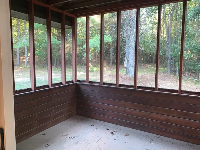 a bathroom with a sink and large window