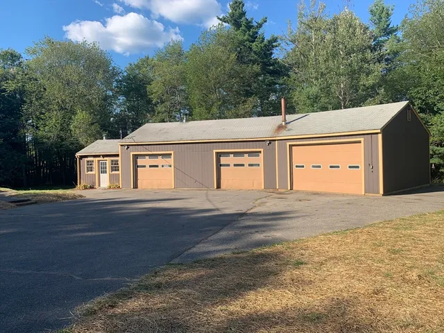 a view of parking garage with cars parked