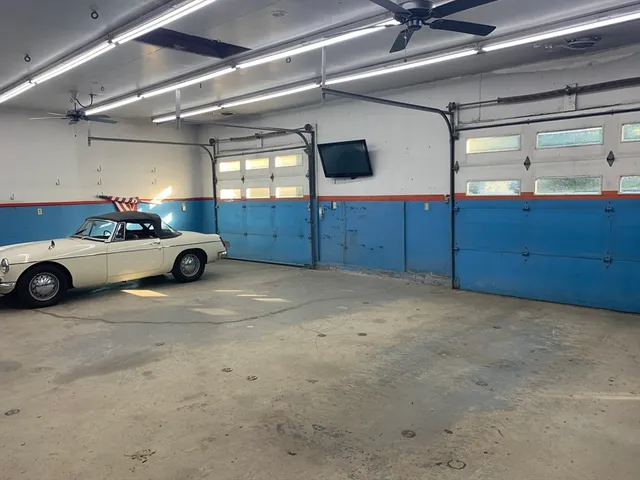 a bathroom with a shower and a sink