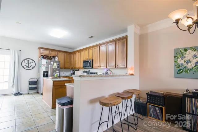 a kitchen with a table and chairs in it