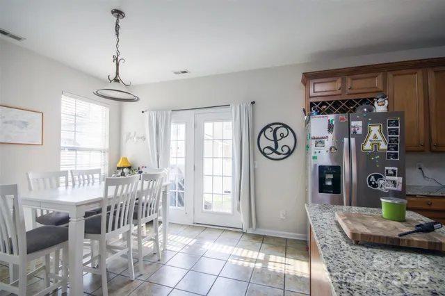 a view of a livingroom with furniture window and hardwood floor