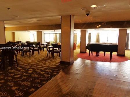 10185 Collins Avenue, Unit PH02 Bal Harbour, FL 33154 - Photo 12 of 37 a lobby with furniture and window