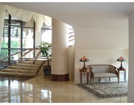 10185 Collins Avenue, Unit PH02 Bal Harbour, FL 33154 - Photo 2 of 37 a living room with furniture and a potted plant