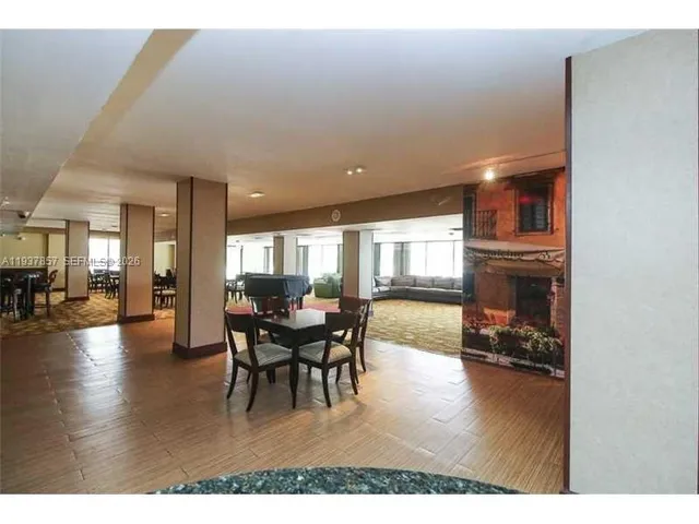 a room with gym equipment and large mirror