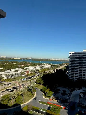 a view of a livingroom with chairs and wooden floor