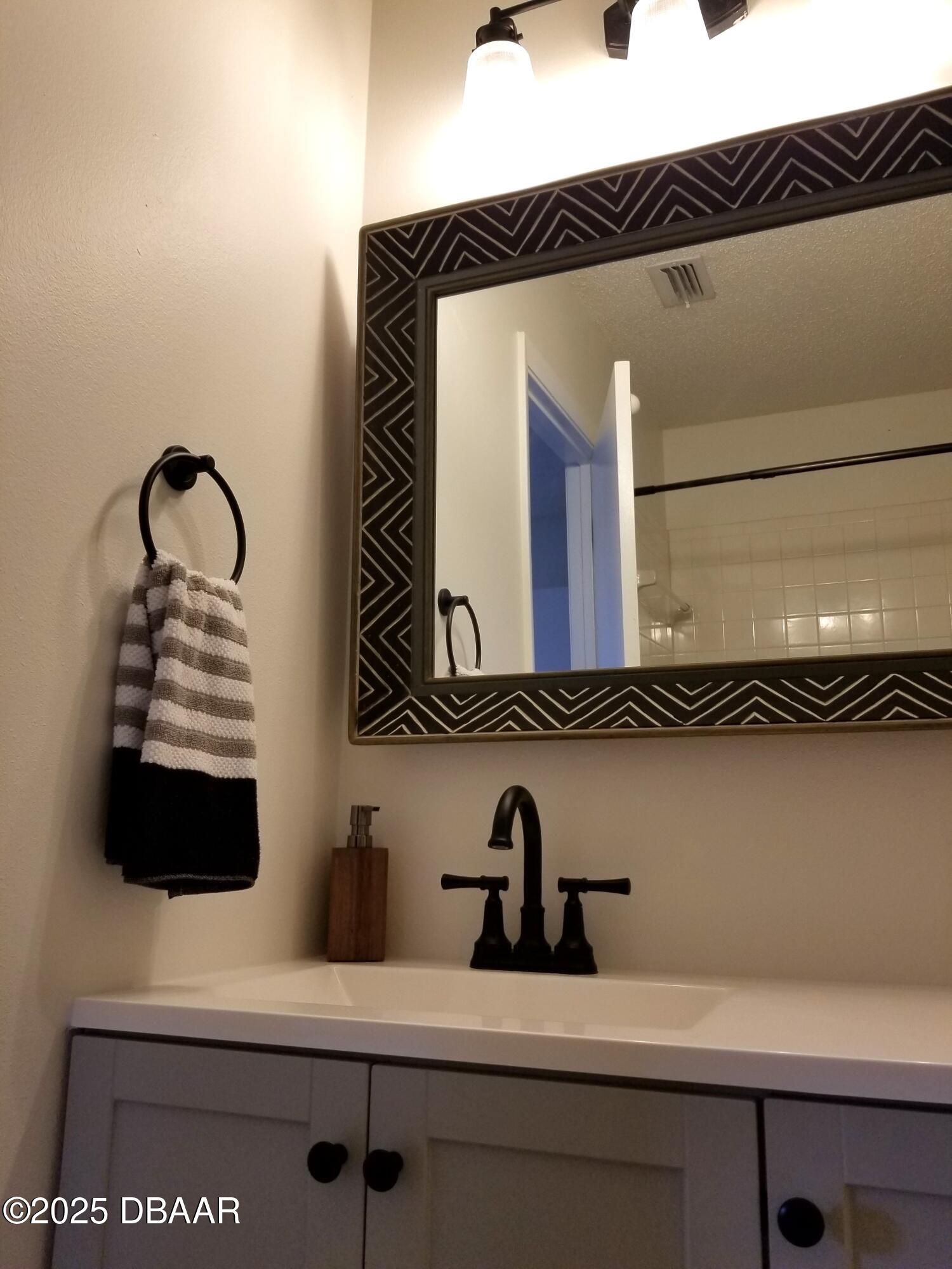 165 White Fawn Drive, Unit MB Daytona Beach, FL 32114 - Photo 23 of 34 165-MB-bath-mirror2