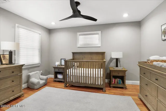 a bathroom with a sink mirror and toilet
