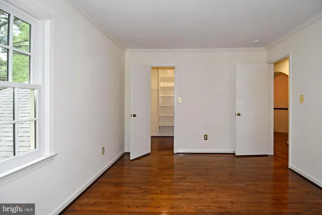 a view of an empty walk in closet