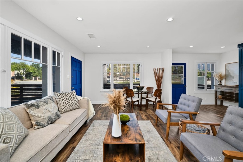 a living room with furniture or couch and a wooden floor