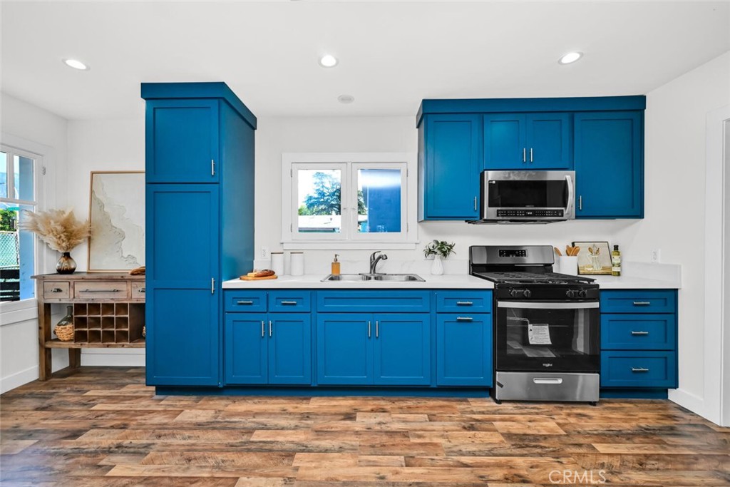 294 Bella Vista Avenue Pasadena, CA 91107 - Photo 16 of 37 a kitchen with stainless steel appliances granite countertop a stove cabinets and a sink