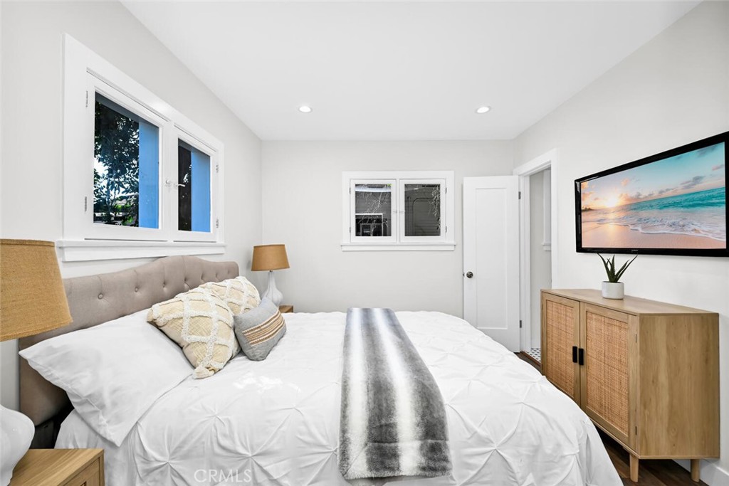 294 Bella Vista Avenue Pasadena, CA 91107 - Photo 21 of 37 a bedroom with a bed and a flat screen tv