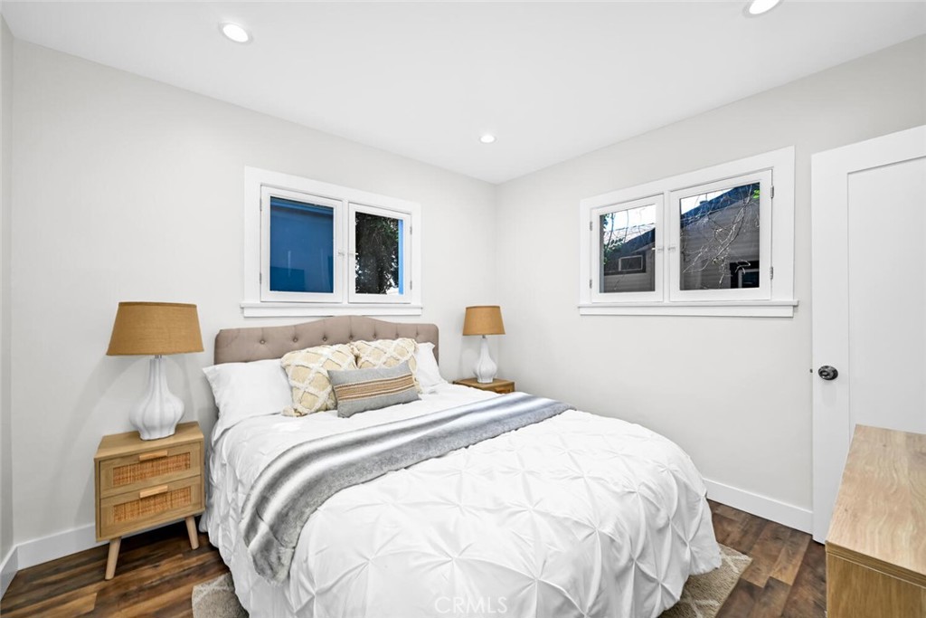 294 Bella Vista Avenue Pasadena, CA 91107 - Photo 22 of 37 a bedroom with a bed and a lamp