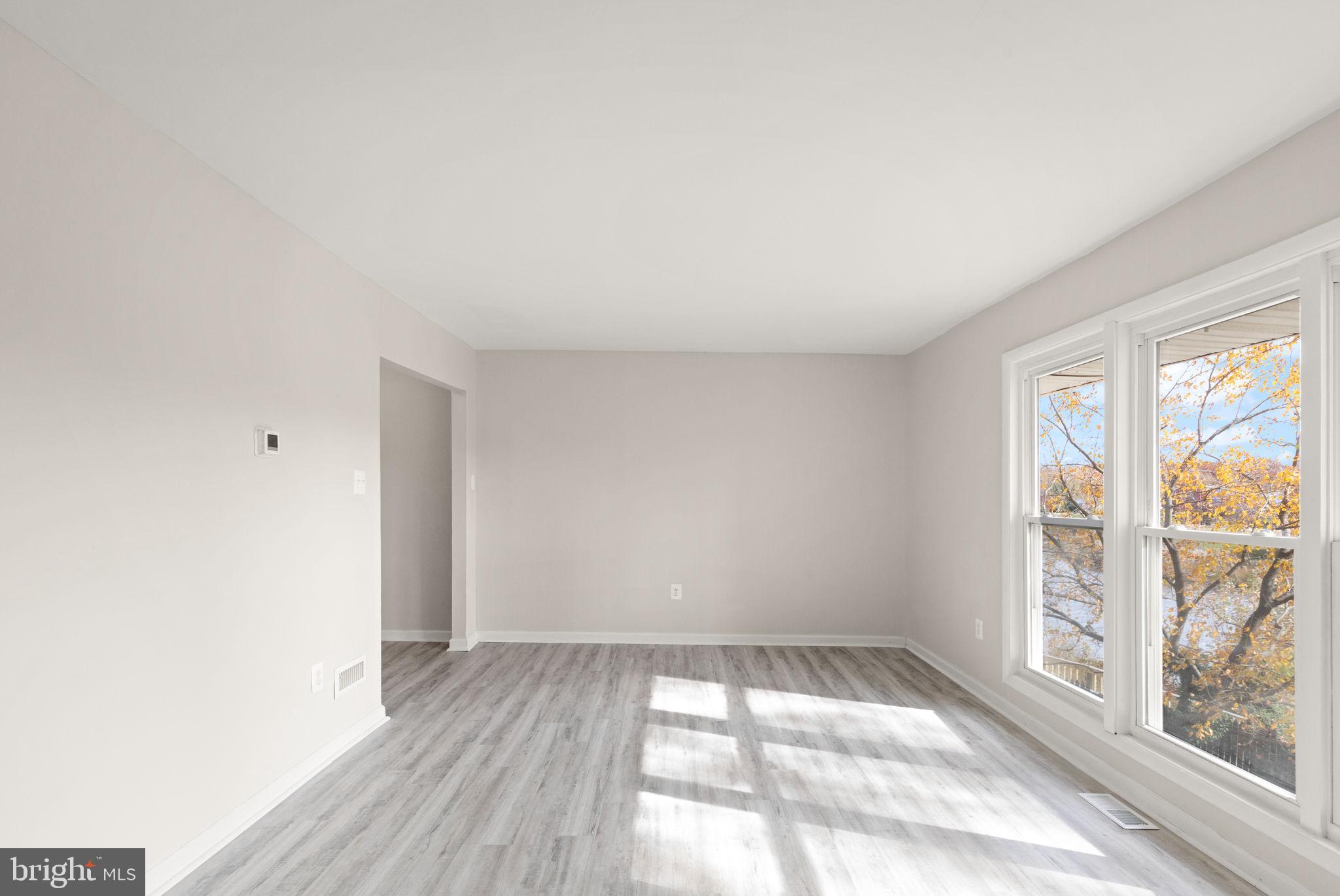 1875 Brookside Drive Edgewood, MD 21040 - Photo 4 of 20 wooden floor in an empty room with a window