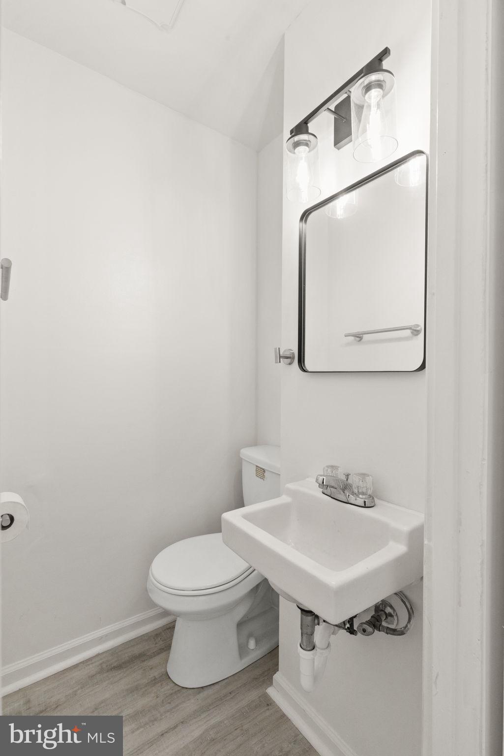 1875 Brookside Drive Edgewood, MD 21040 - Photo 9 of 20 a bathroom with a toilet a sink and mirror