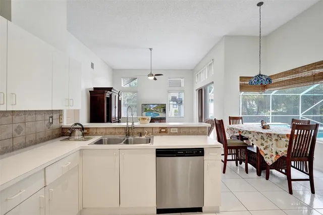 a bed room with a bed and a chandelier