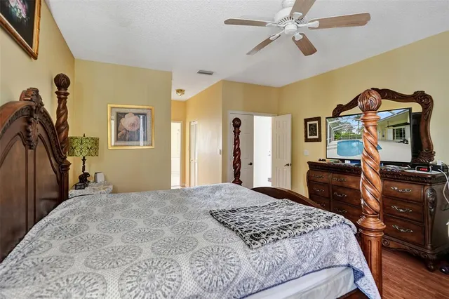a spacious bathroom with a tub sink and mirror
