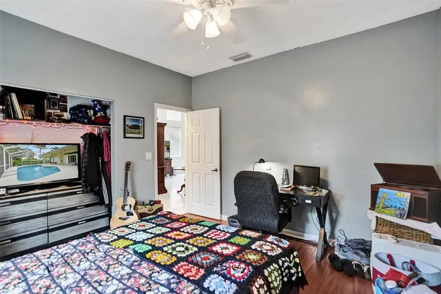 a view of a backyard with swimming pool