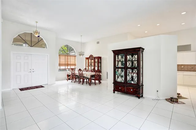 a view of a dining room with furniture window and outside view