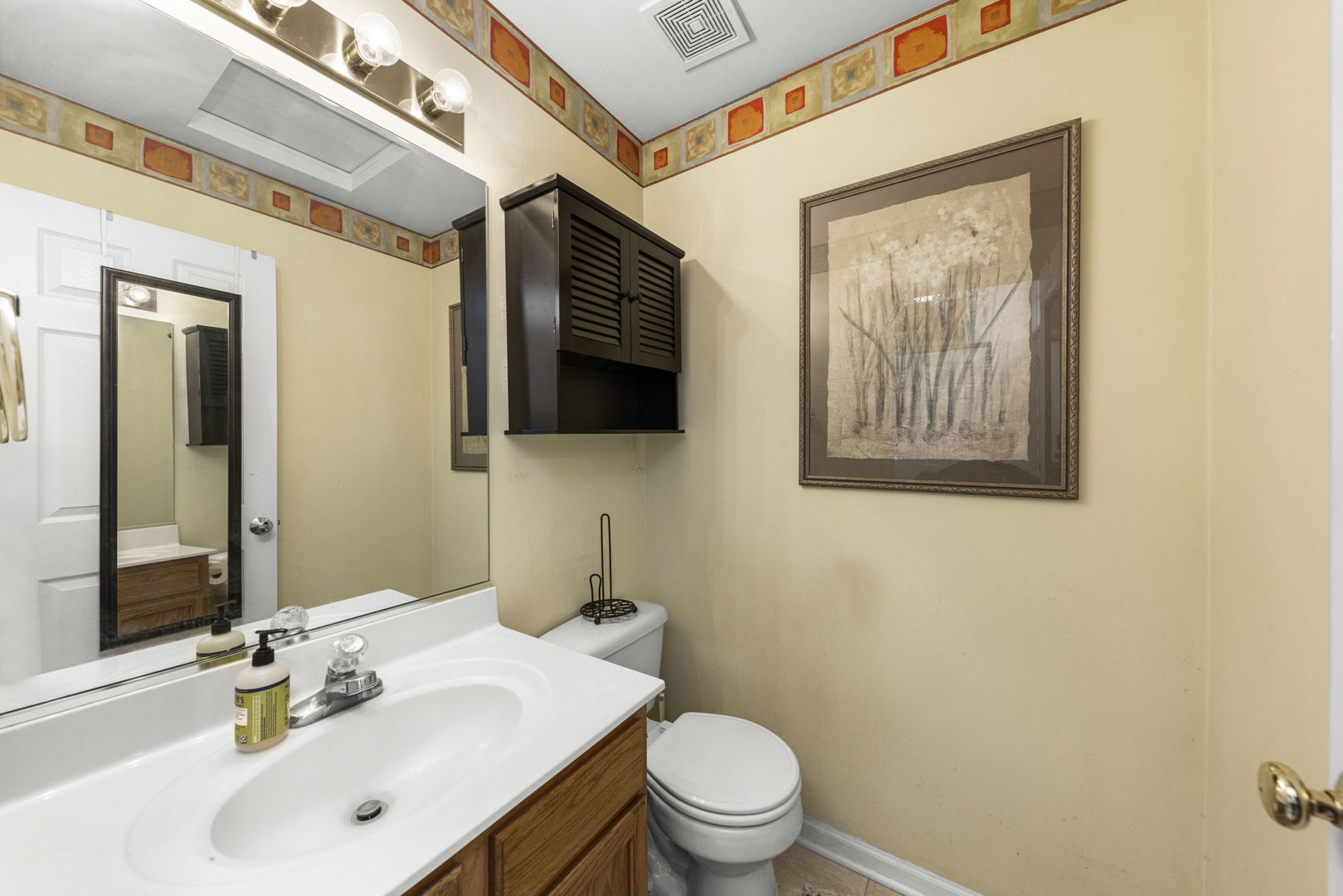 2202 Carpenter Avenue Plainfield, IL 60586 - Photo 14 of 29 a bathroom with a toilet a sink and mirror