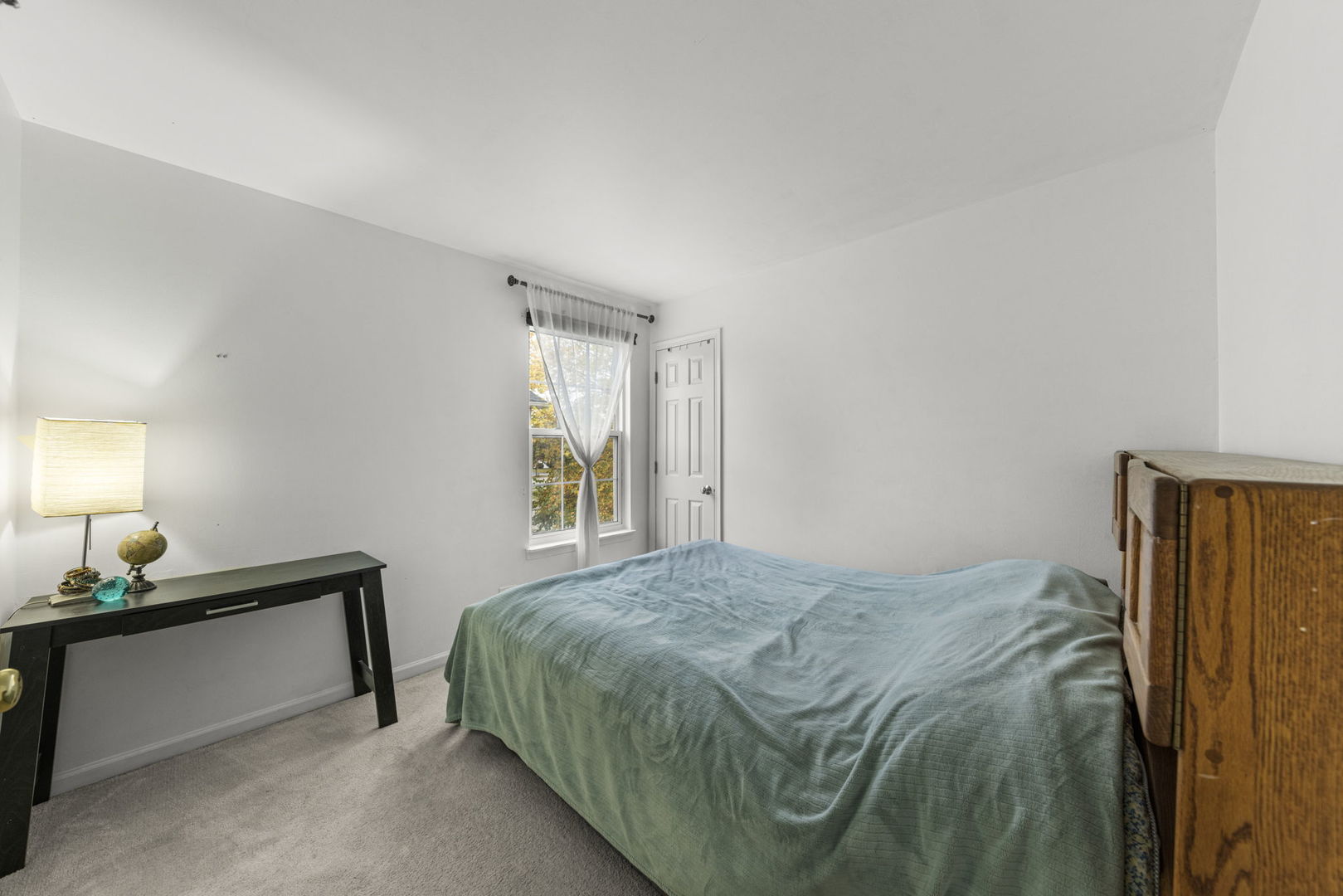 2202 Carpenter Avenue Plainfield, IL 60586 - Photo 19 of 29 a bedroom with a bed and a window