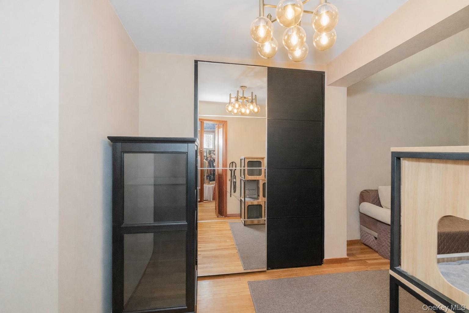 2400 East 3rd Street, Unit 607 Brooklyn, NY 11223 - Photo 8 of 21 a view of a kitchen from the hallway