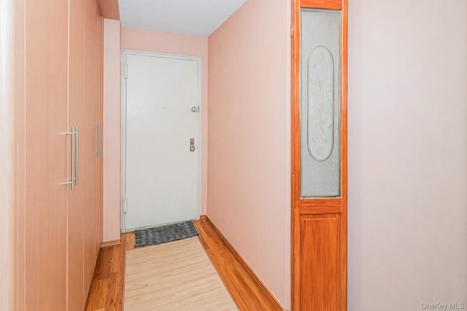 2400 East 3rd Street, Unit 607 Brooklyn, NY 11223 - Photo 10 of 21 a view of a hallway with wooden floor