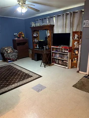 a room with furniture and a flat screen tv