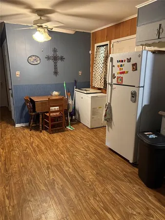 a kitchen with stainless steel appliances a stove a refrigerator and a cabinets