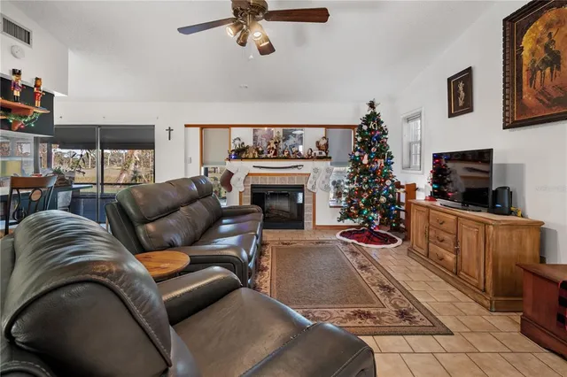 a living room with furniture a rug and a fireplace