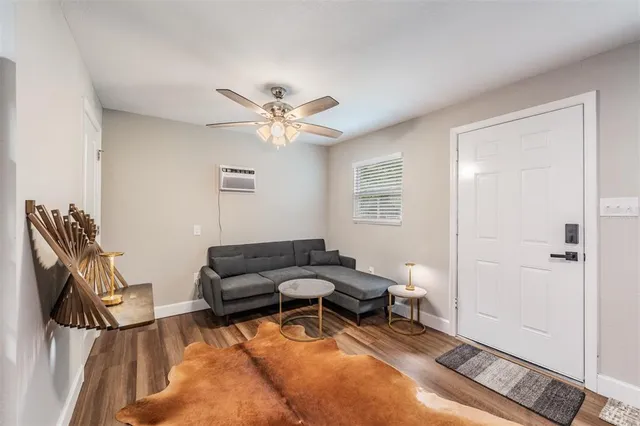 a living room with furniture and a window