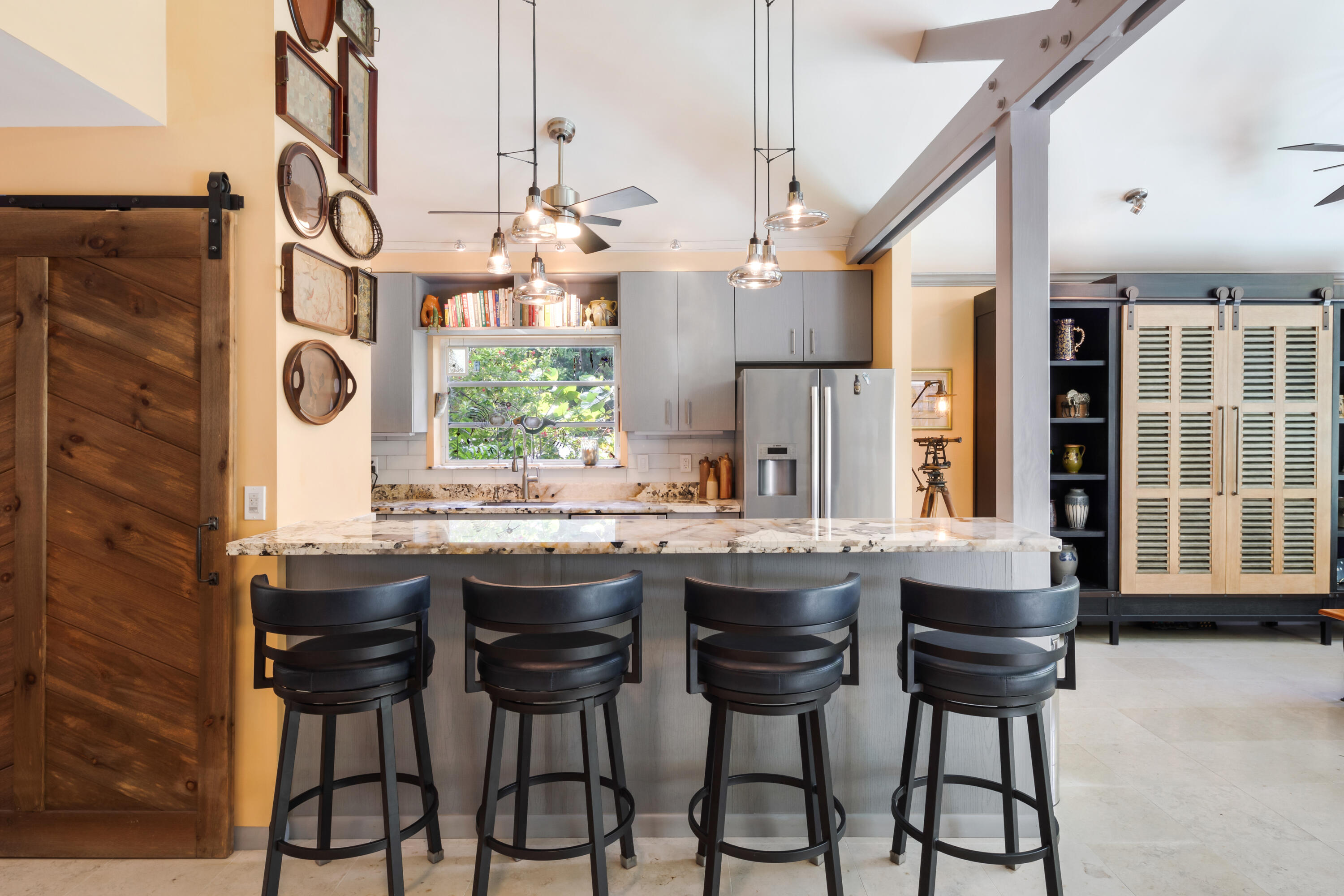 1501 Laird Street Key West, FL 33040 - Photo 14 of 40 a kitchen with a sink and chairs