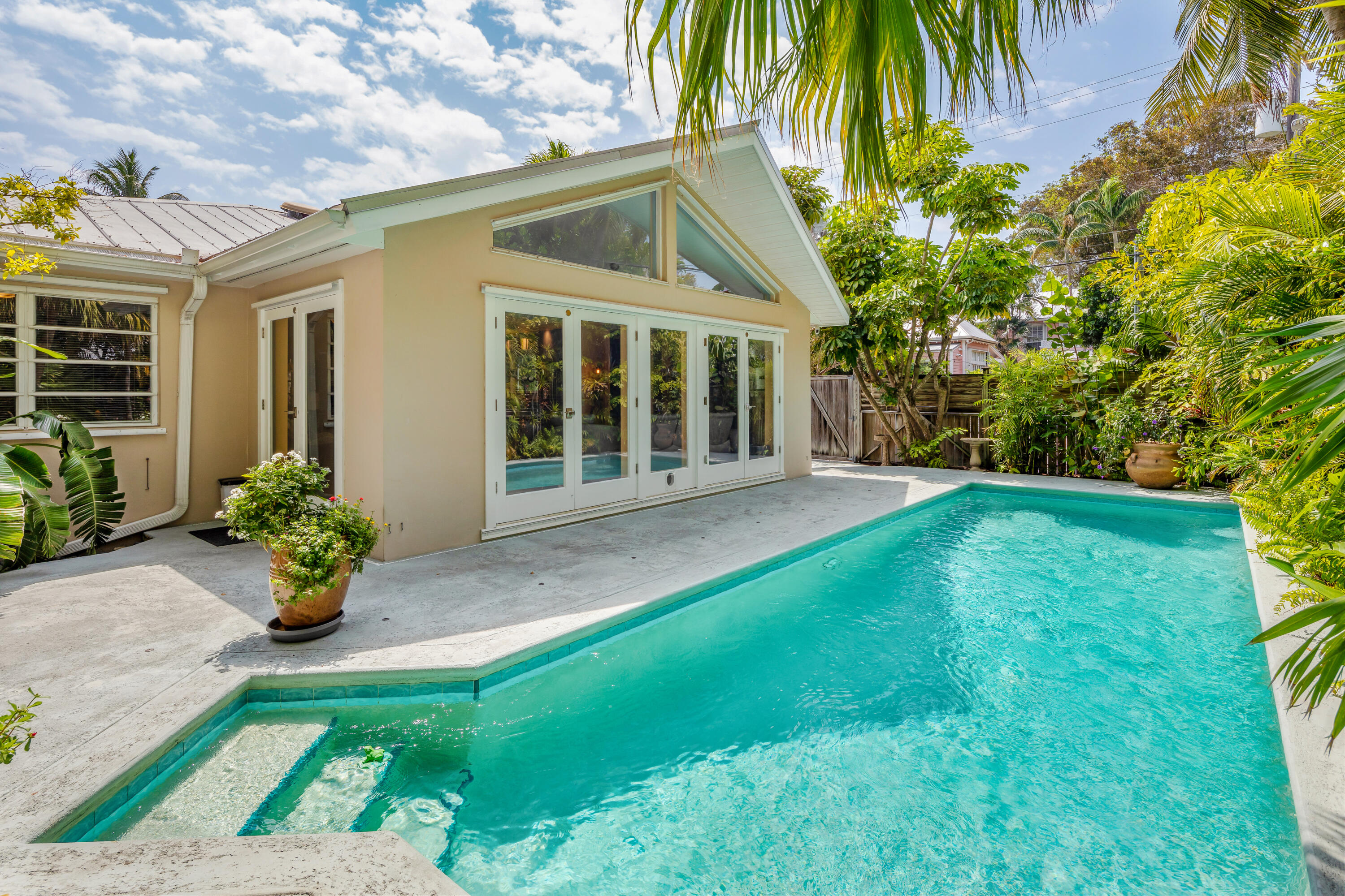 1501 Laird Street Key West, FL 33040 - Photo 2 of 40 a front view of a house with a garden
