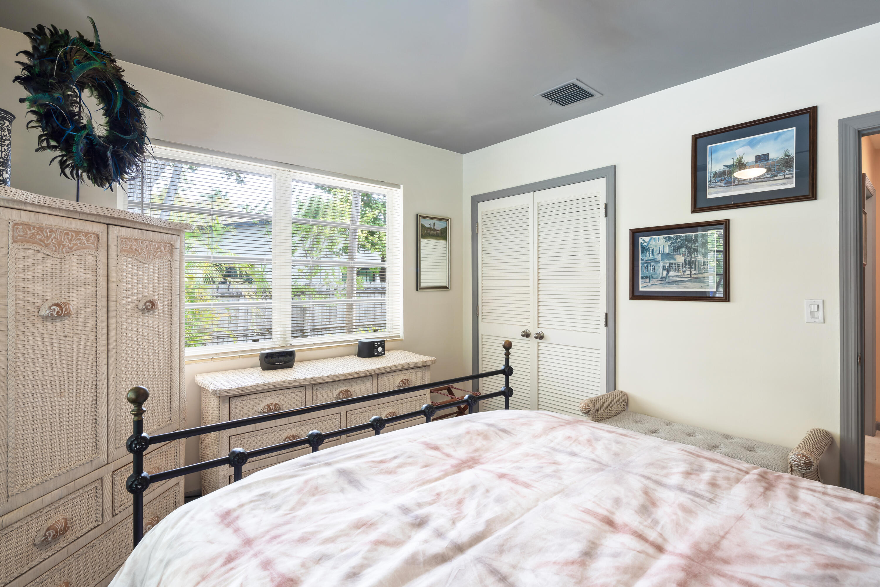 1501 Laird Street Key West, FL 33040 - Photo 21 of 40 a large bedroom with a bed and a window