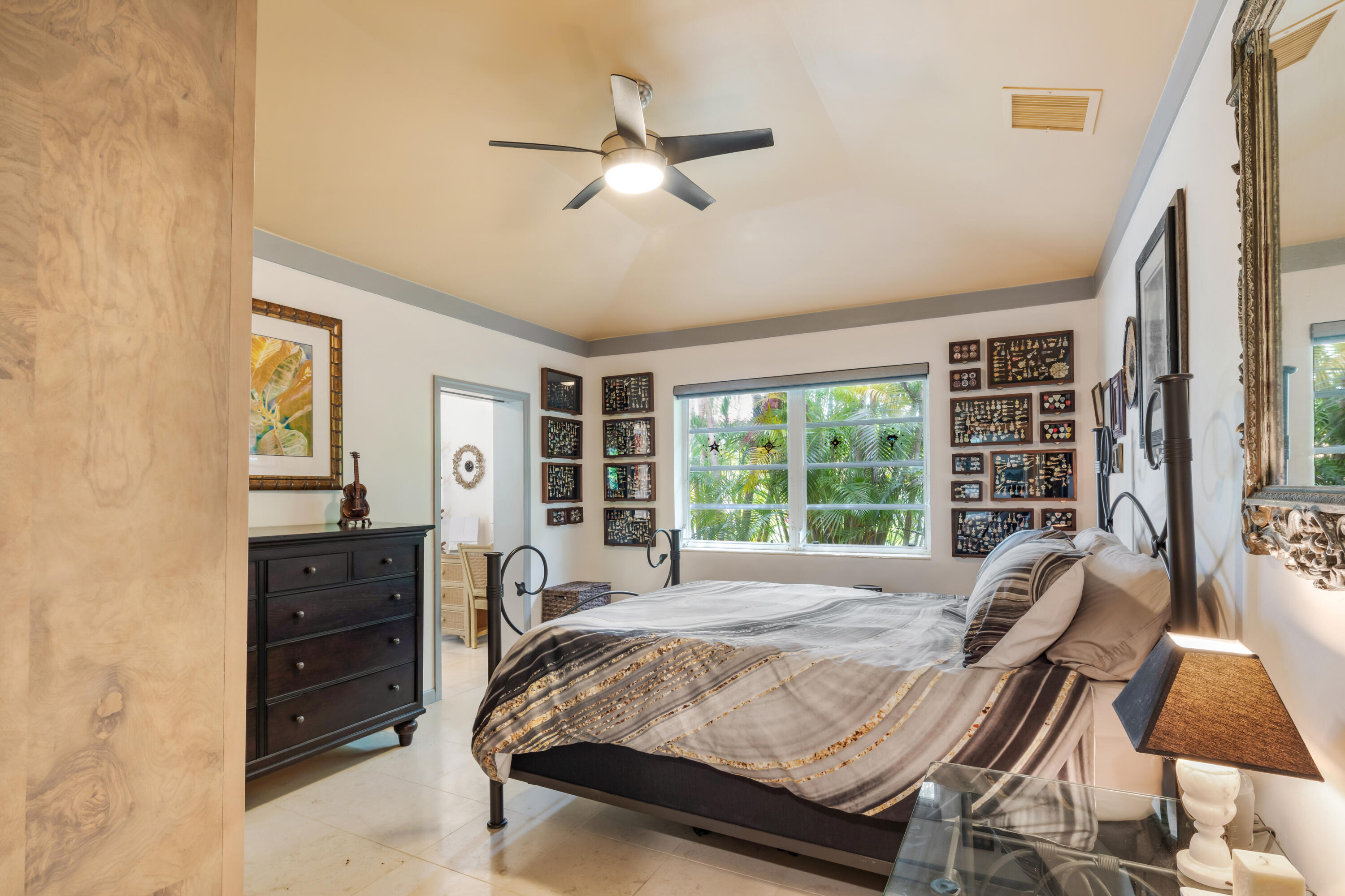 1501 Laird Street Key West, FL 33040 - Photo 23 of 40 a bed sitting in a spacious bedroom next to a window and a flat screen tv
