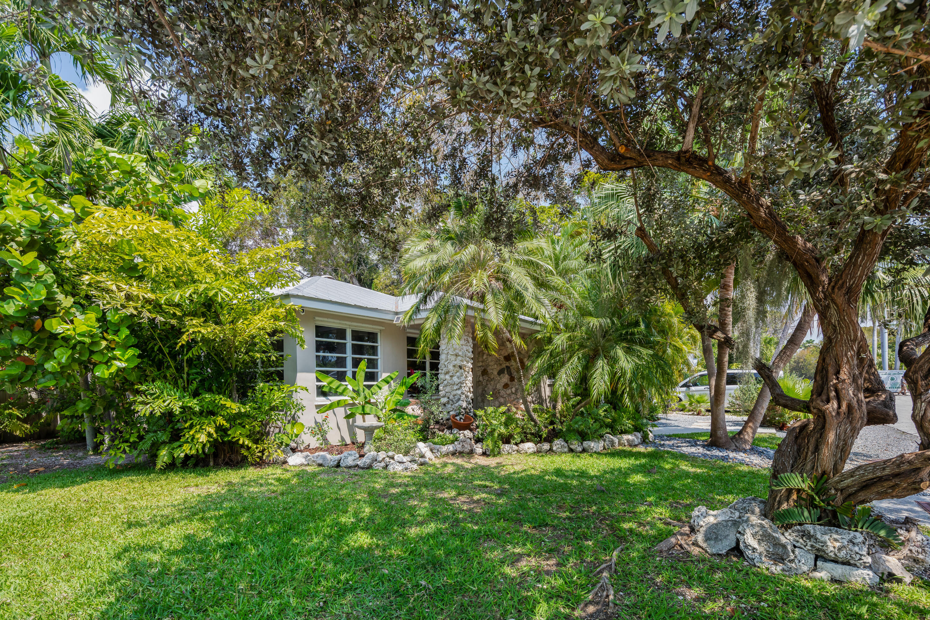 1501 Laird Street Key West, FL 33040 - Photo 5 of 40 a view of a house with backyard garden and trees