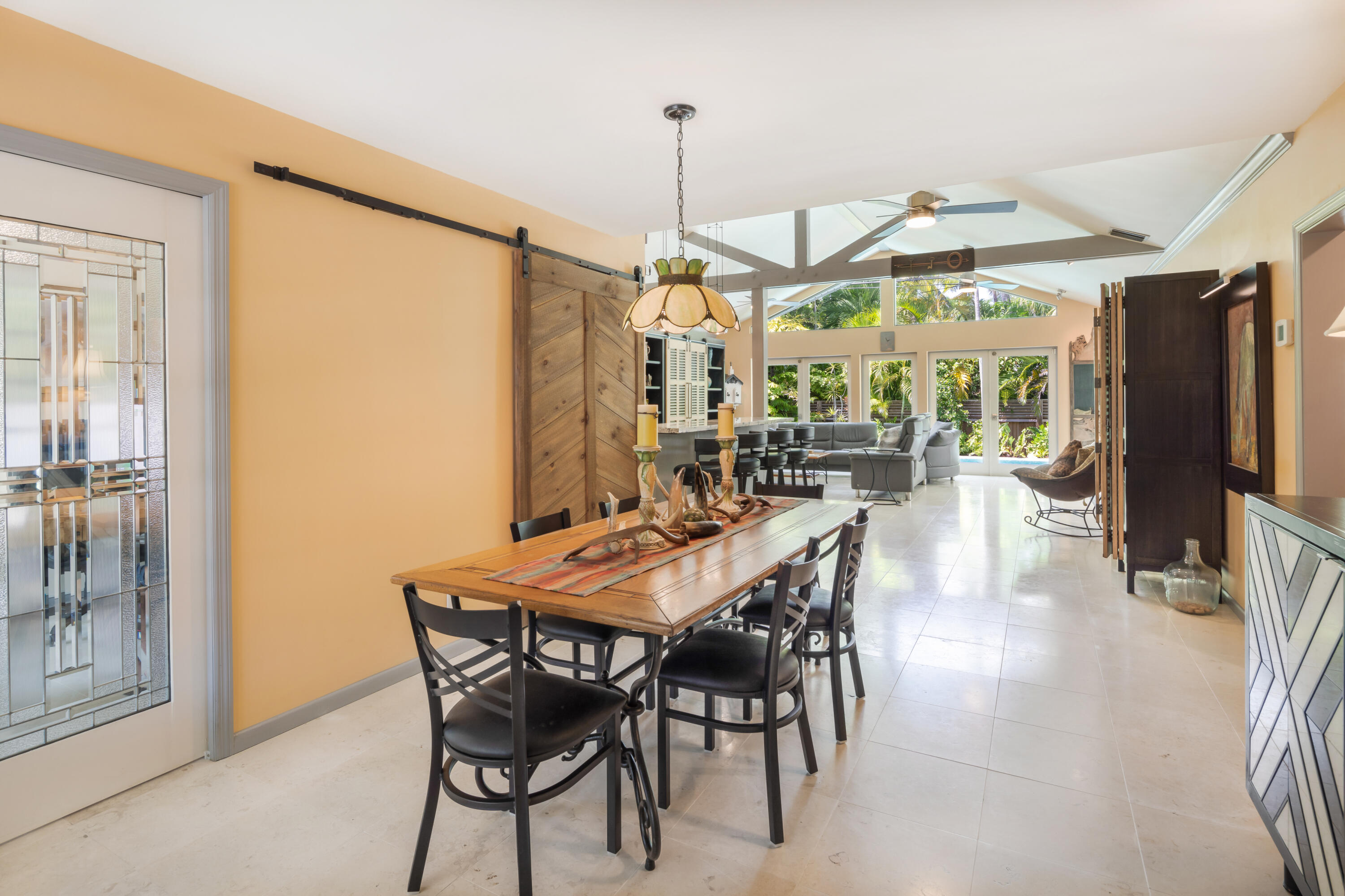 1501 Laird Street Key West, FL 33040 - Photo 7 of 40 a dining room with furniture window entryway and wooden floor