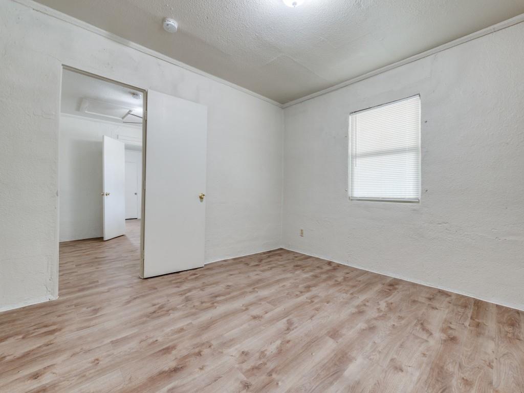 3440 Terrell Street Dallas, TX 75223 - Photo 5 of 11 an empty room with wooden floor and windows